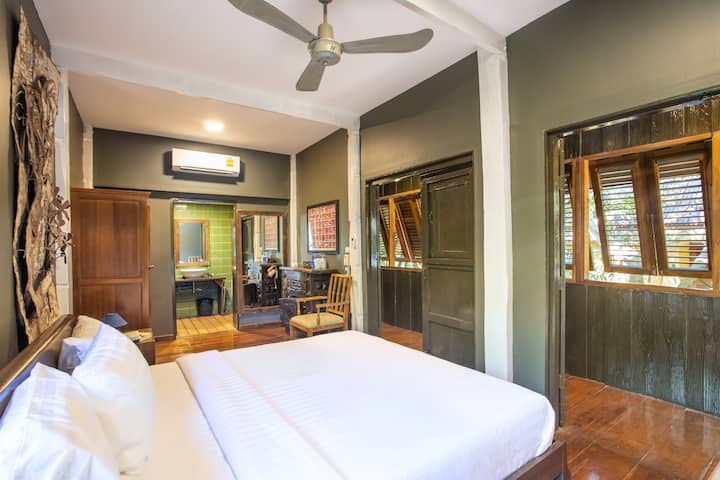 Bedroom 3 in a renovated Lanna rice barn