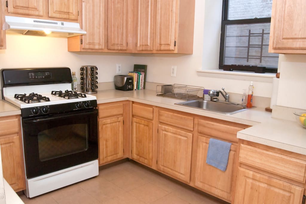 Plenty of counter space and kitchen appliances to cook your favorite meal. And you'll find dishes, silverware, coffee mugs, spices and more in the cabinets.