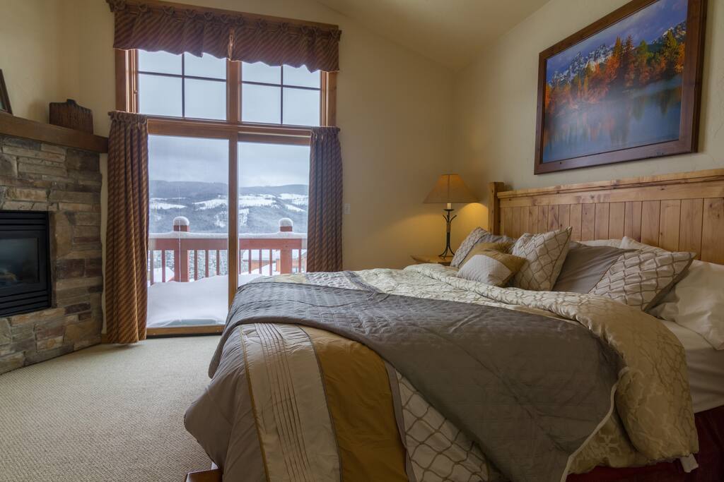 Master suite with bathroom, fireplace and private balcony.