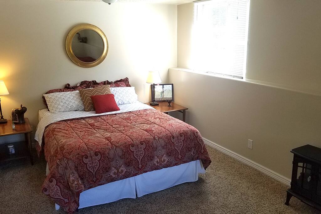 Master bedroom- queen sized bed plus a sitting area