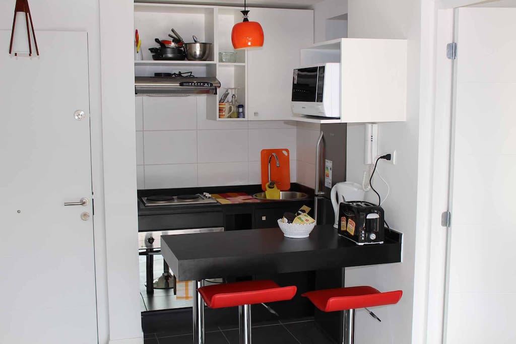 open kitchen, dining table, chairs, kitchenware