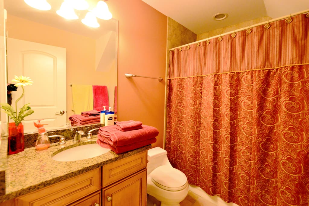 Full en-suite bathroom with shower and bath tub