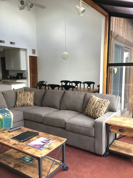 New sofa couch in Living room open to dining room and kitchen