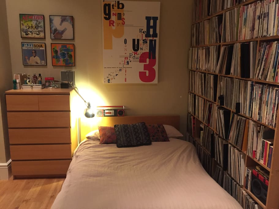 Large bay windowed Master bedroom with extensive magazine, book and vinyl collection and mirrored wardrobe