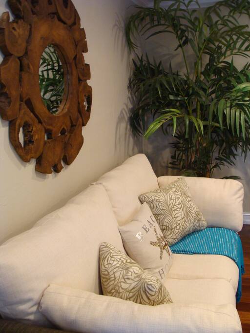 Beautiful White Comfy Couch turns into a pull out bed for extra guests.
