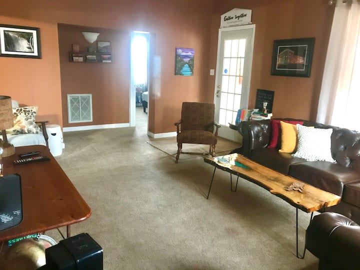 Living room with plenty of room to spread out. Walls covered with local art.