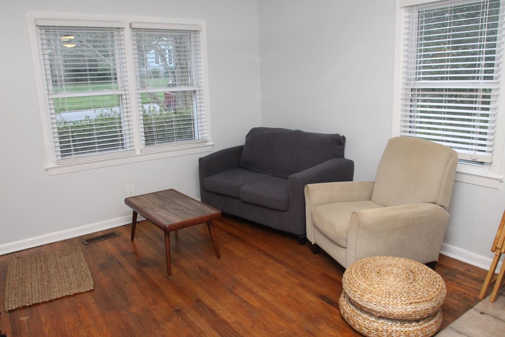 Come in, and relax in this cozy living room, complete with a recliner and TV (which is wall-mounted opposite the recliner).