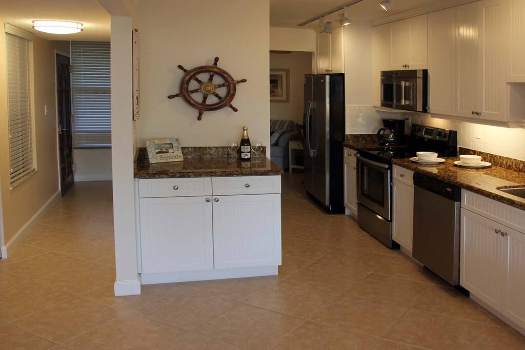 Well stocked kitchen with stainless steel appliances