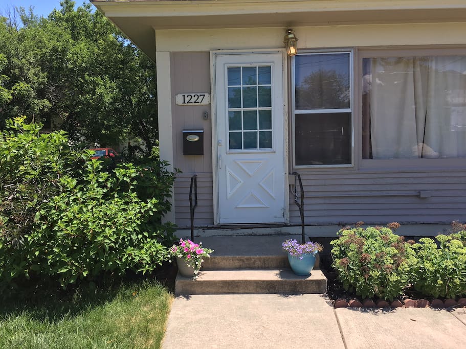 Front of the house, showing the lockbox. We will be changing out the light fixture and moving it to the left.