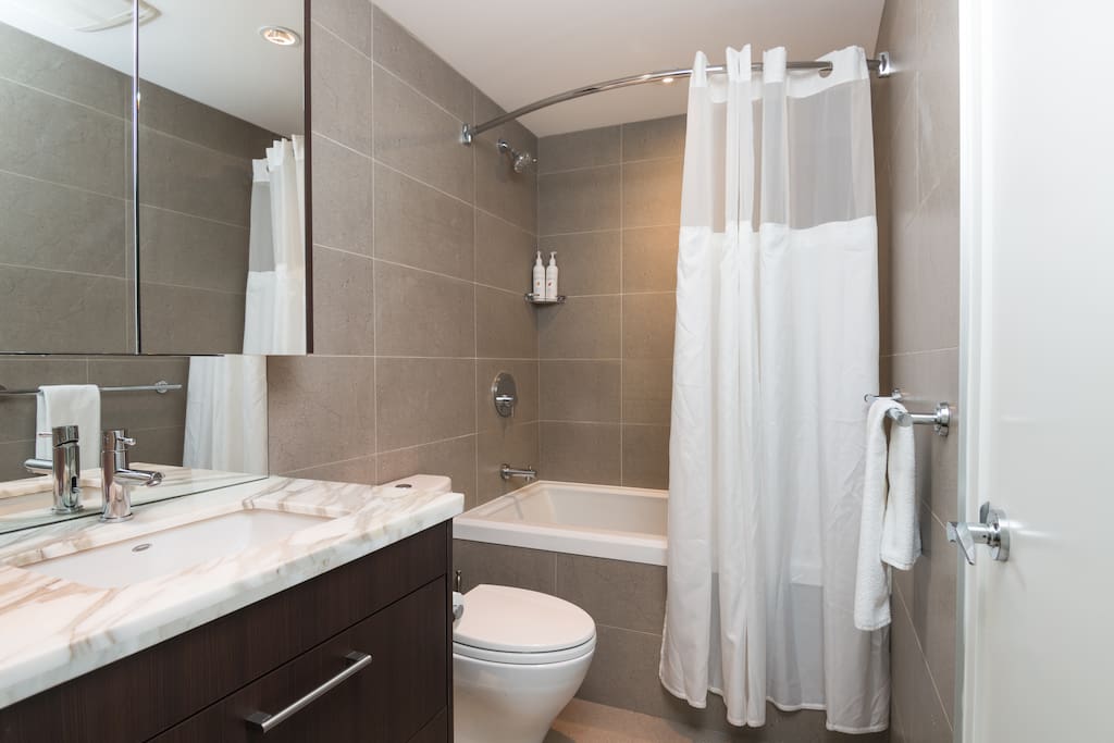 Clean bathroom with a soaker bathtub and a fantastic shower