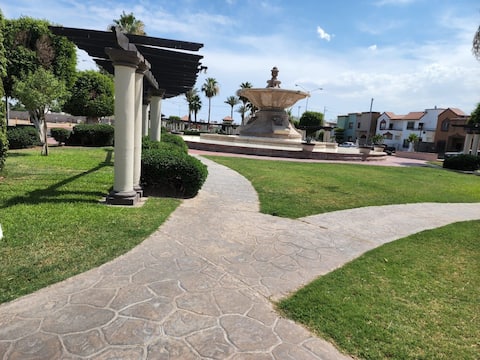 Casa Sevilla in front of the park