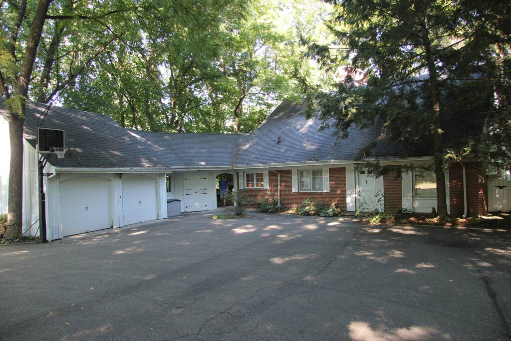Looks can be deceiving! 3 floors of living space nestled on a bluff overlooking the river - beautiful wrap-around views