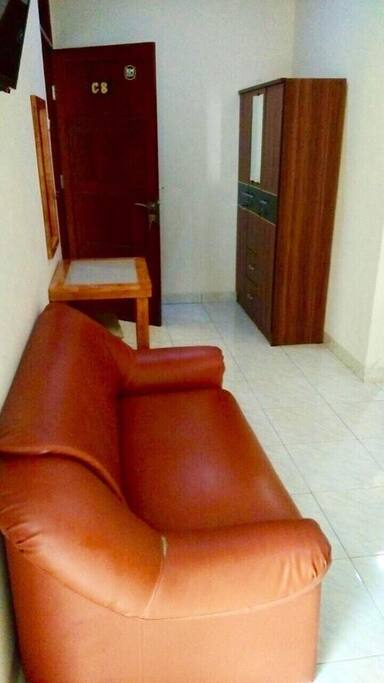 COUCH UNDER THE TV AND CLOSET