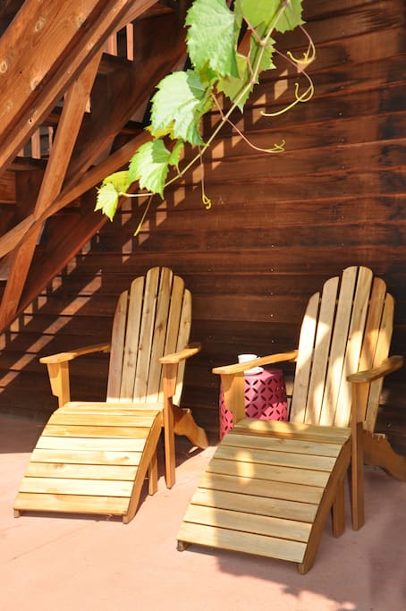Adirondack chairs next to the front door.