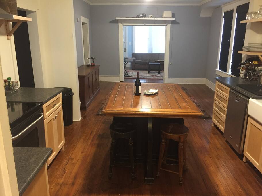 Kitchen to the dining / movie-viewing room to the living room
