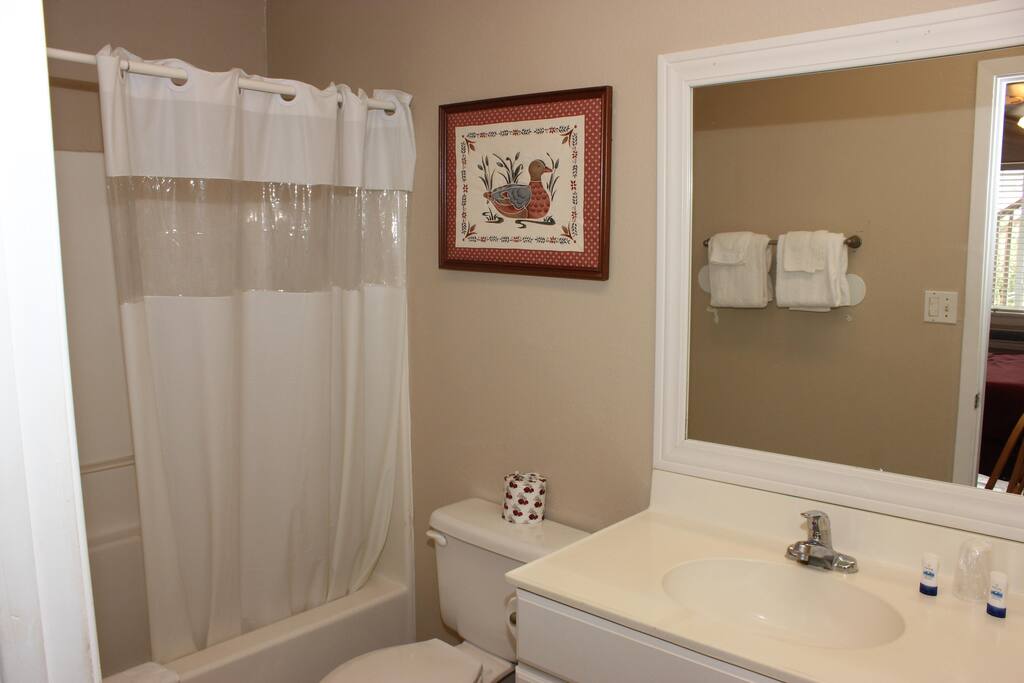 Second of three bathrooms for