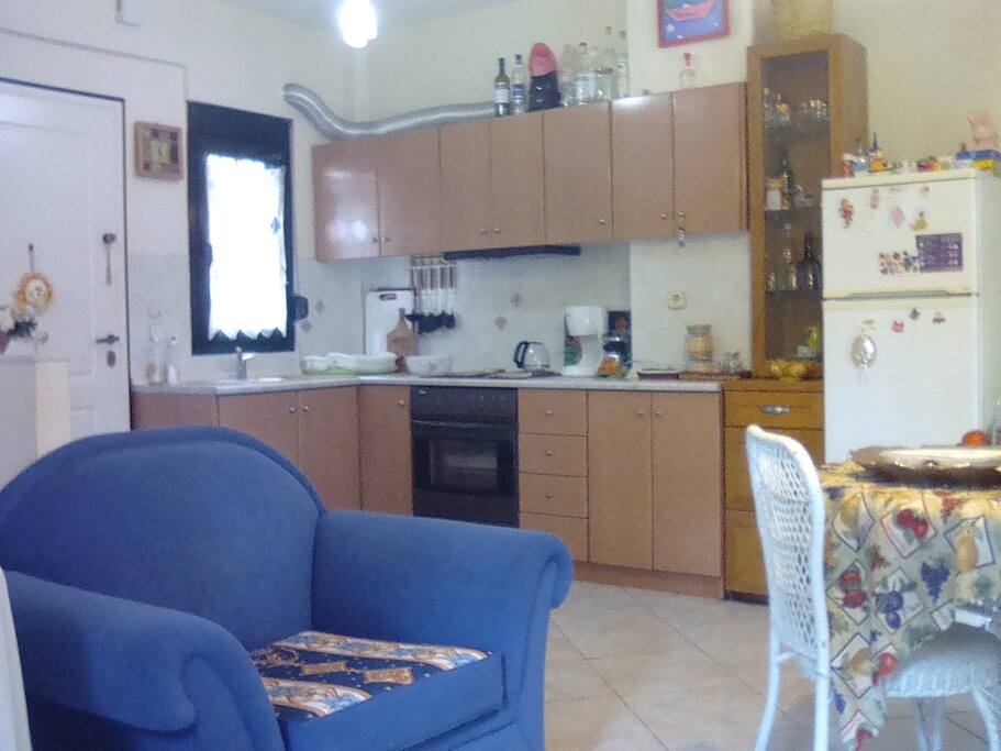 kitchen alcove and living room; cooker, fridge, stereo with vynil LP player!