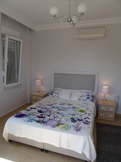 Master bedroom, air con, balcony, wardrobes.