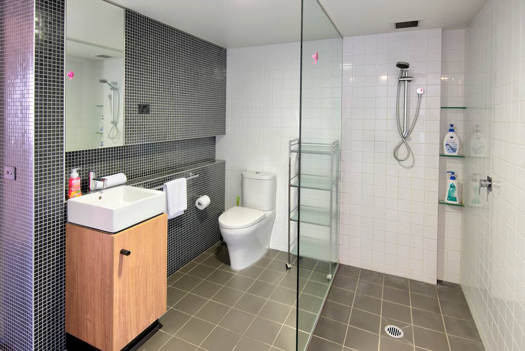 The bathroom is fully equipped with towels, bodywash, shampoo and hairdryer