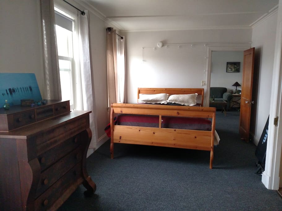 Comfy,handmade, queen size sleigh bed for you and antique dresser for your clothes.