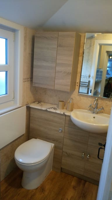 Bathroom with bath and shower