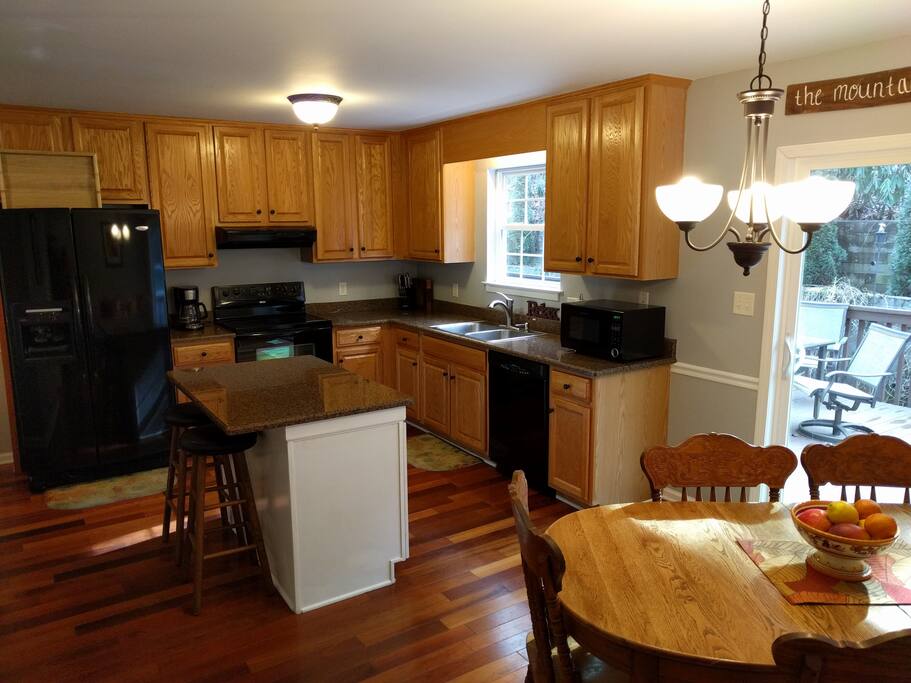 Well stocked kitchen with crockpot, griddle, blender and tons of dishes, pots and pans