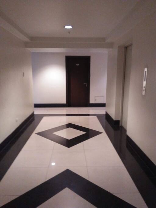 Hallway within the floor, elevators on the right