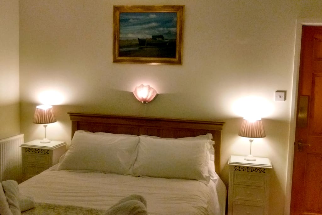 Light and airy double bedroom - very comfortable bed and top quality linen provided!