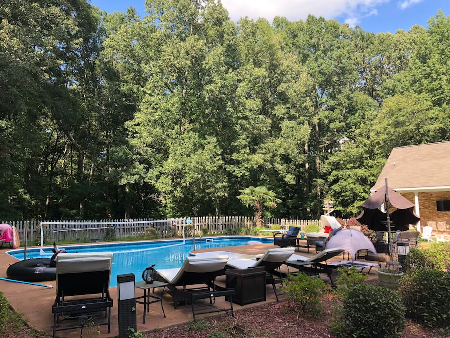 The pool area with comfortable lounge chairs.