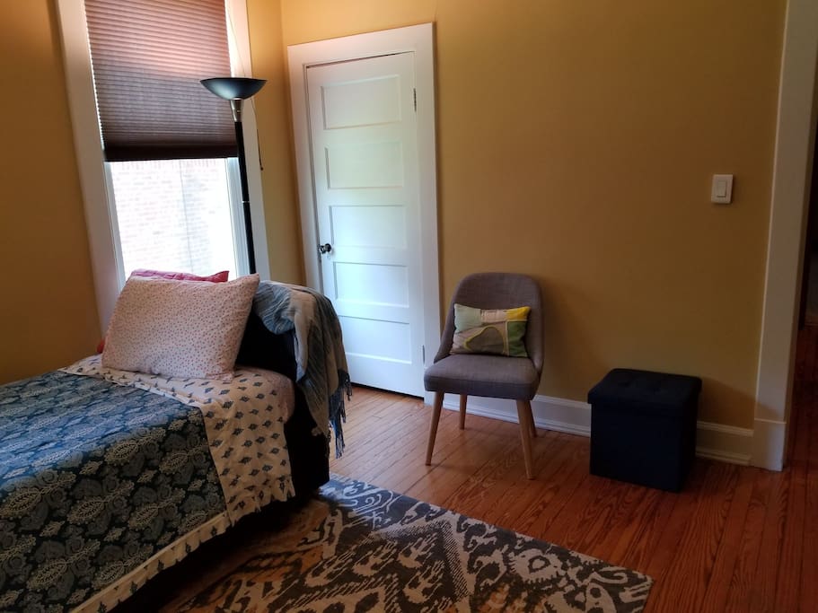 Room features plenty of storage, cozy chair to kick back and relax.