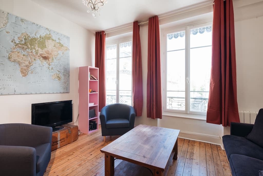 Spacious living room with a flat screen TV.