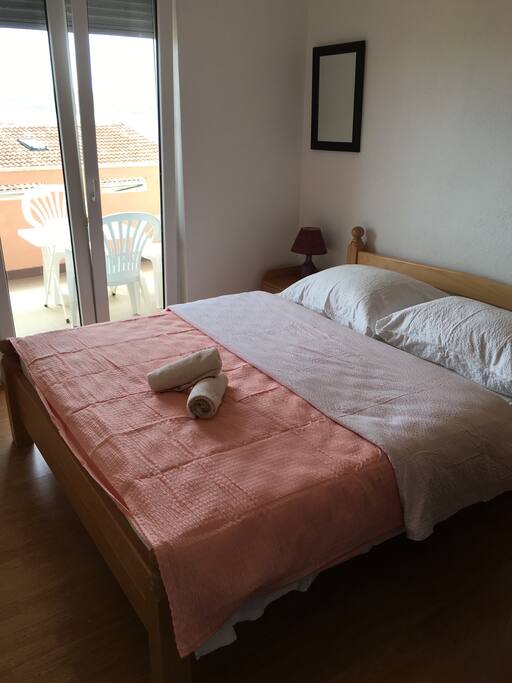 Room with exit to the balcony that is connected to dinning room and kitchen