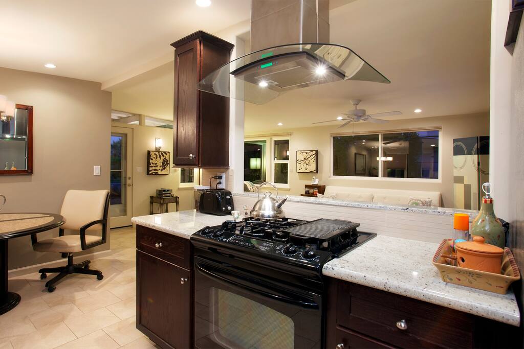 Kitchen with views of living room! Gas range, microwave, toaster oven with eat-in kitchen!