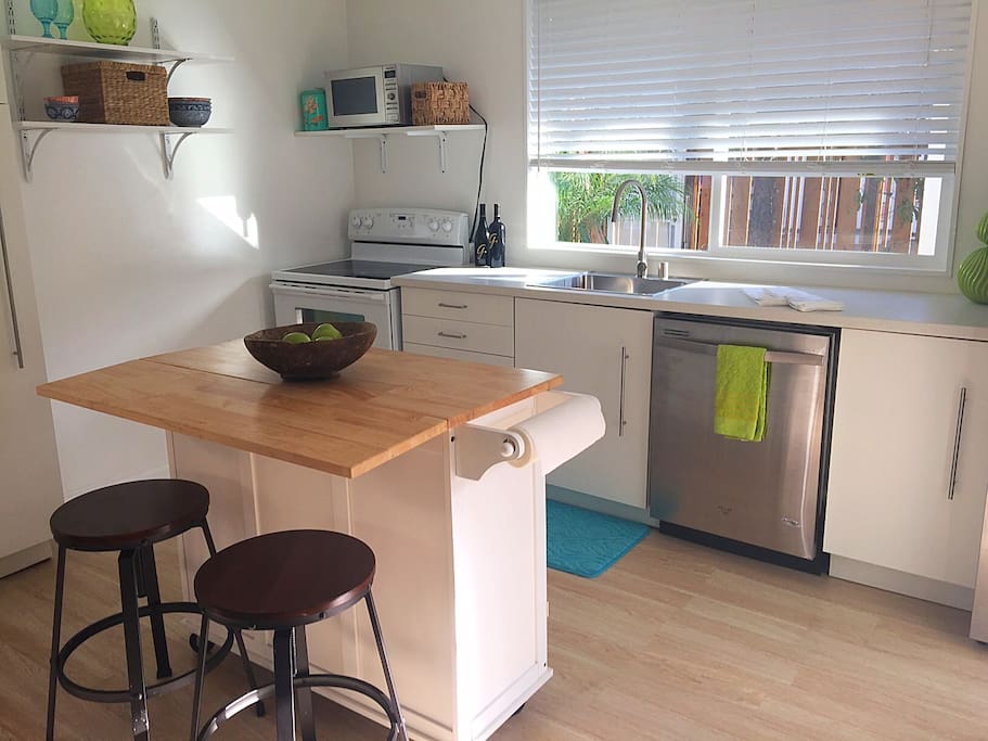 Open kitchen leads to living room, perfect for cooking & set up with everything you need!