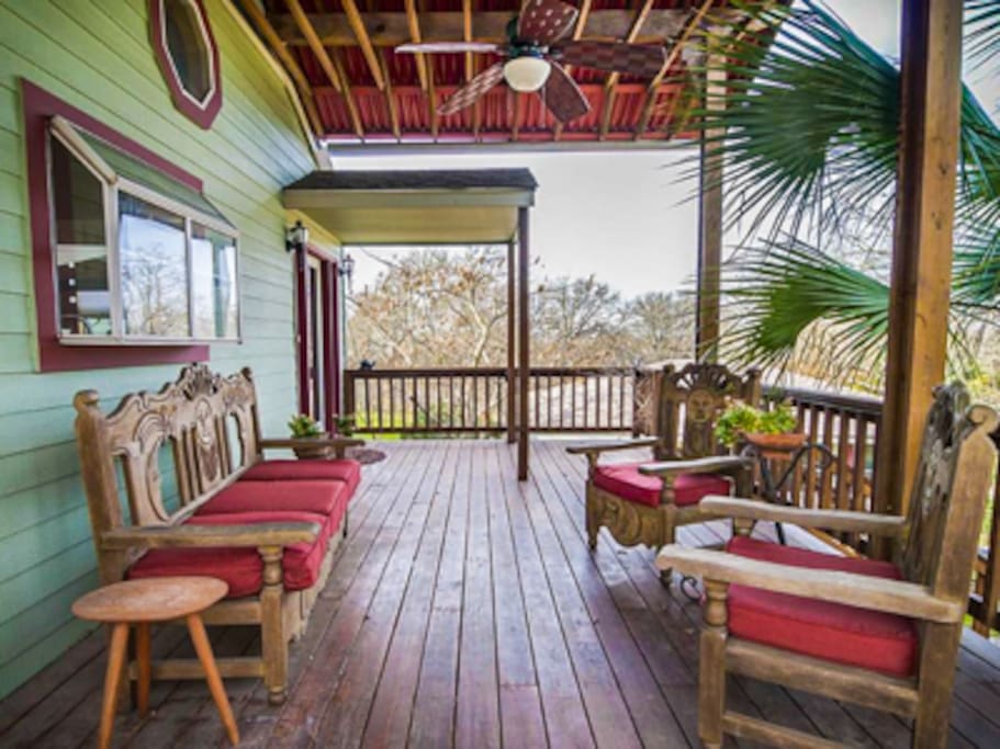 The front porch is very spacious and with deck fan and vaulted ceiling.