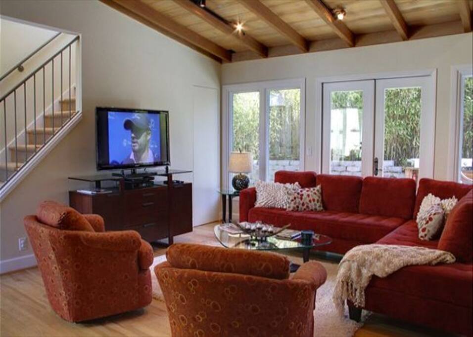 Great room has walls of windows and patio doors for lots of light.