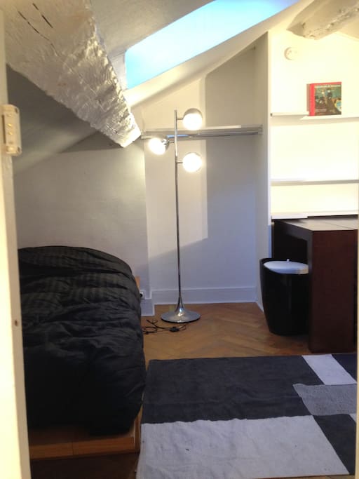 Cozy mansard with original wooden beams