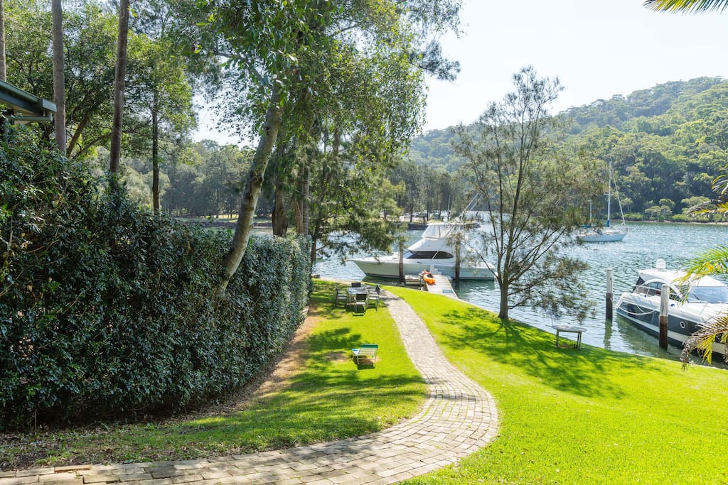 Waterfront with lawn, jetty, swimming and kayaking facilities