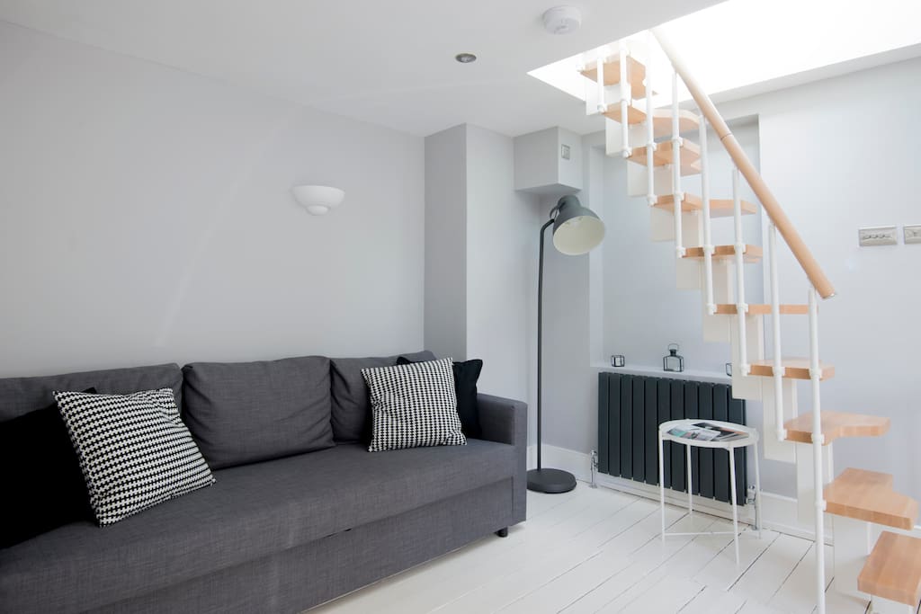 The lounge area and stairs to the roof terrace