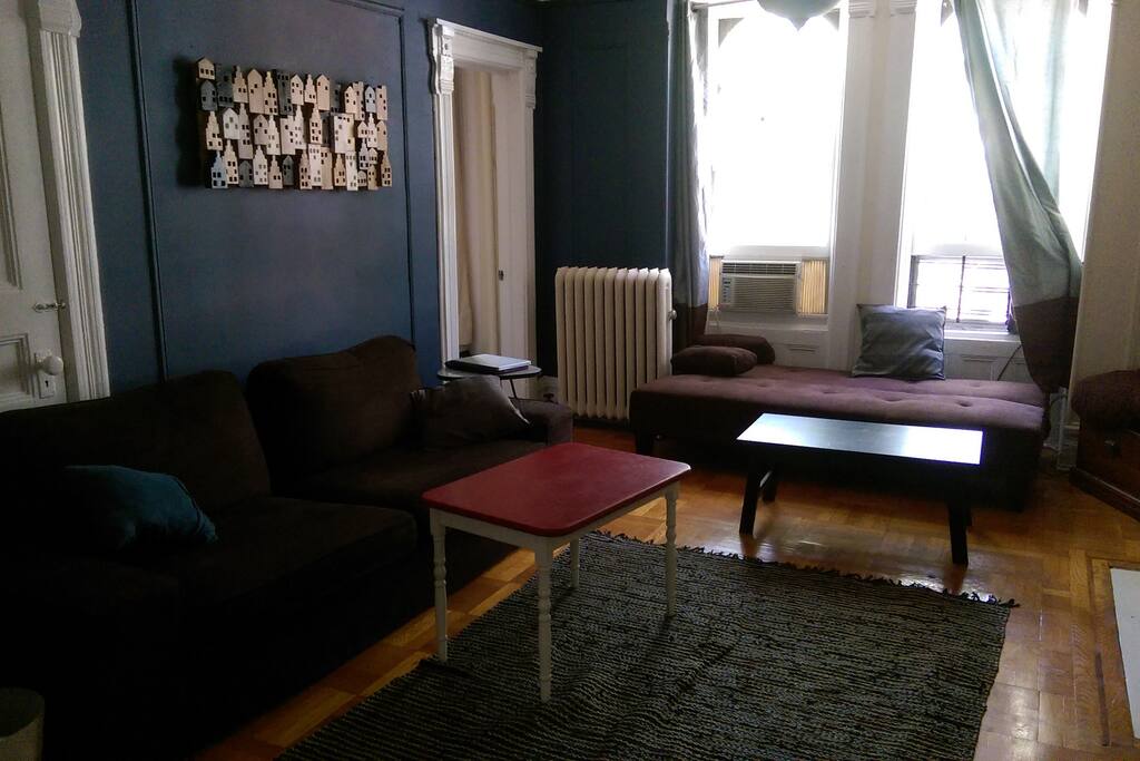 Living room with 2 couches. Enough to fit your whole group and very comfortable to sleep in