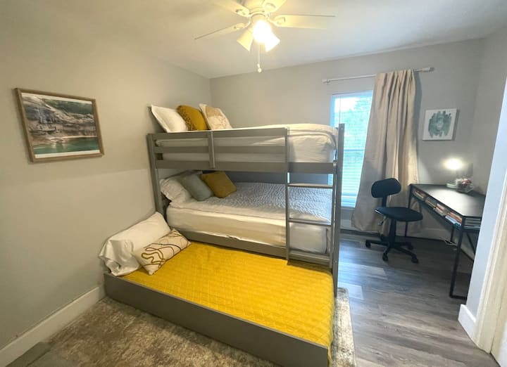 Your kids will enjoy playing and sleeping in this room complete with a full on full bunkbed and twin trundle, desk, tv, and books to read while you enjoy quality time in the living room. 