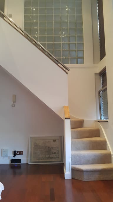 stairs from lower area to 1st floor main bedroom and lounge/dining area...kitchen