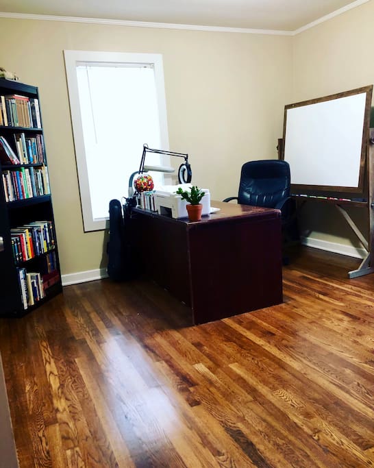 Spare room; large desk, white board, scanner, printer