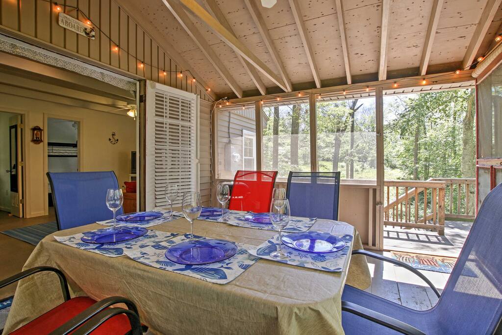 The screened-in back porch is ideal for dining on warm summer evenings.