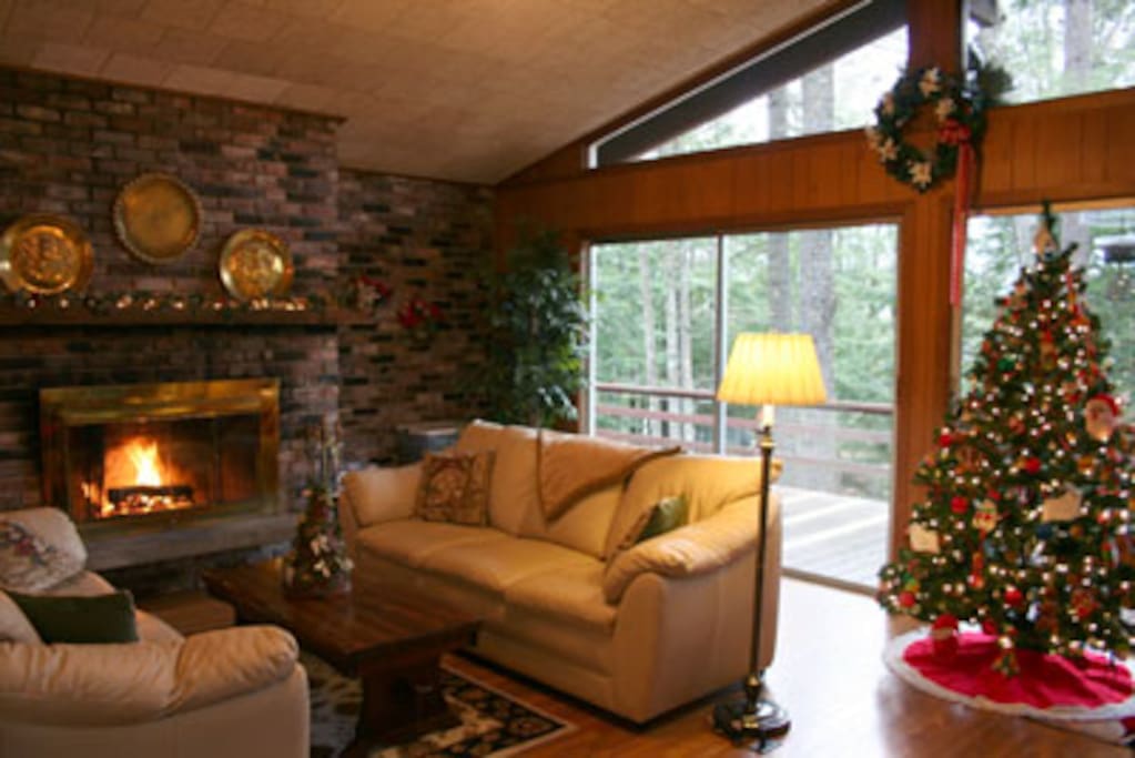 upstairs living room with wood burning fireplace