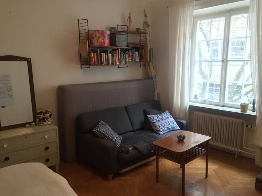 Comfy couch, Extra mattress just behind it, and a hammock hanging in the corner ready to roll.