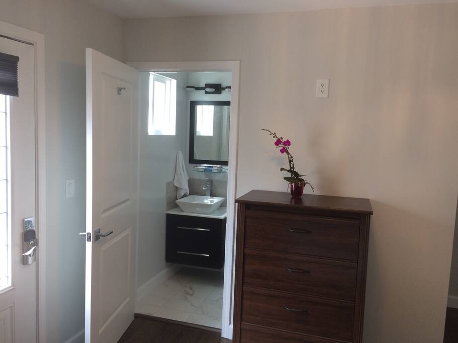 small private bath and dresser
