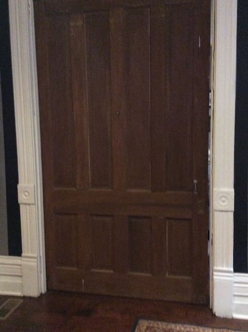 Enter your room through a large pocket door in the main entry hall into what was once the "parlor" .