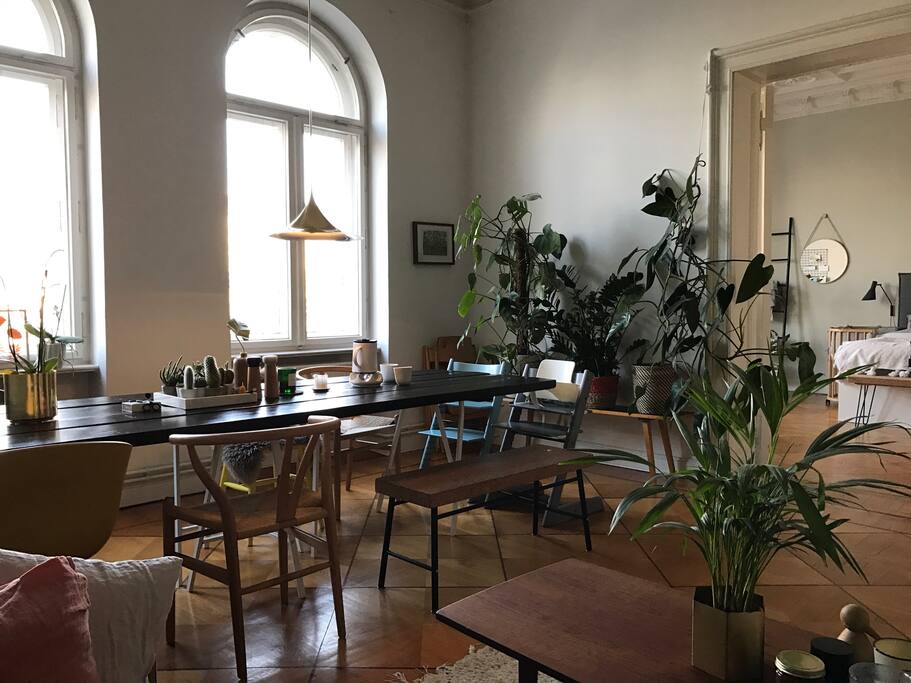 A 3m long table and two kids' Tripp Trapp chairs.