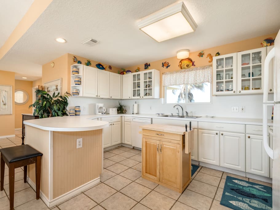 The well-equipped kitchen includes a starter supply of dish soap and paper towels for your convenience.